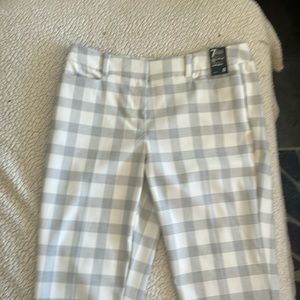 White and black plaid pants.